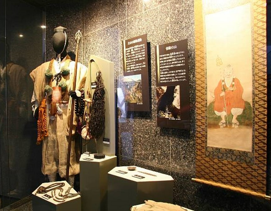 A mountain ascetic (figure) and a ritual staff (shakujō)